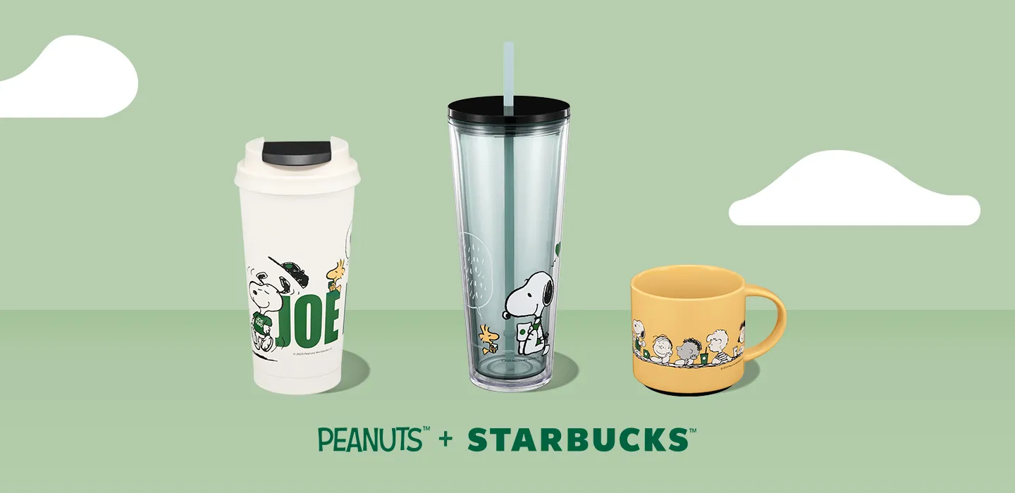 Peanuts + Starbucks drinkware: a Joe Kind Snoopy cup, a clear tumbler with Snoopy and a Peanuts gang mug on a pale green background