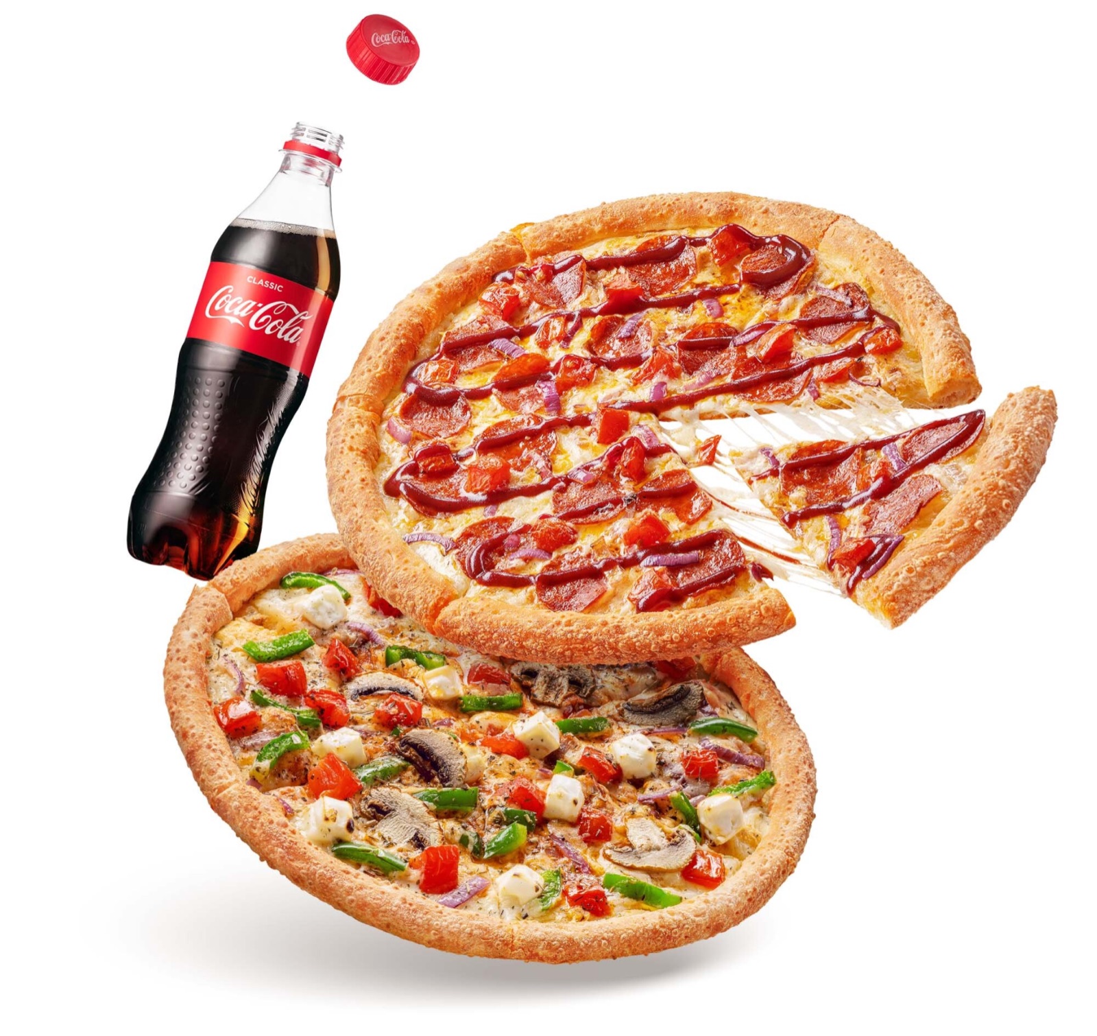 Two pizzas, the top one with a slice pulling away, and a bottle of Coca-Cola with its cap flying off, floating on a white background