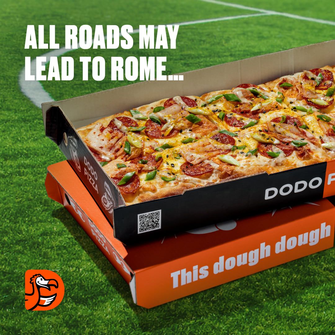 Post: “All roads may lead to Rome…” over a Roman-style pizza in a Dodo Pizza box on a football pitch